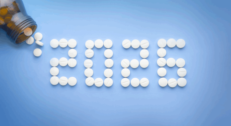 White pills spilling out over a blue background, spelling out "2026".