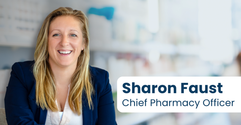 Headshot photo of Sharon Faust, PharmD, Chief Pharmacy Officer at Navitus in front of a blurred pharmacy setting.