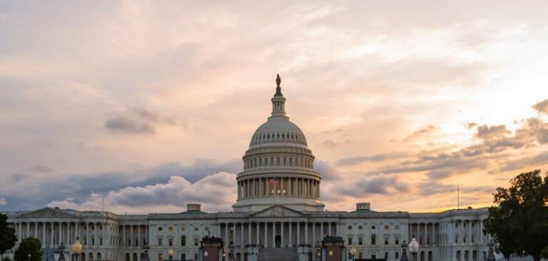 The U.S. Capitol building framed against a cloudy sunset sky, symbolizing state and federal legislative and regulatory updates for the pharmacy benefit management industry.